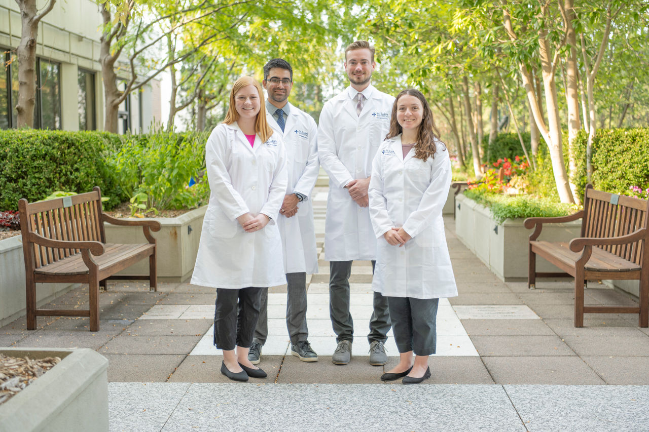 People in white coats standing